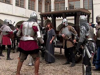 Two knights fuck a peasant woman in a wooden house